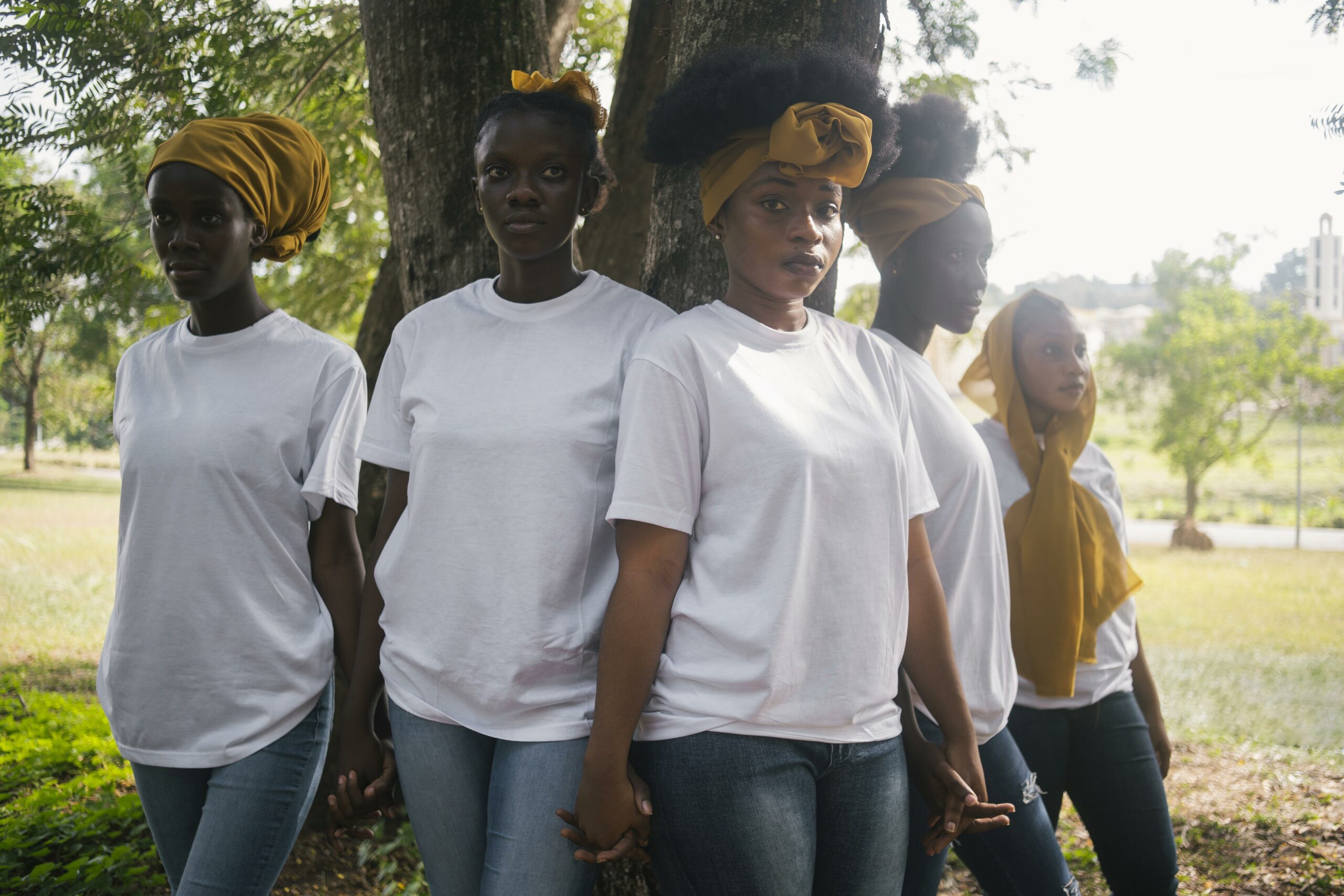 women holding hands outdoors medium shot scaled